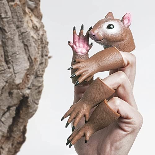 Adult hand demonstrating how the tiny squirrel head and limb puppets fit comfortably onto fingers.