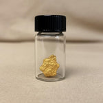Zurjy gold paydirt and raw panning concentrate in studio lighting