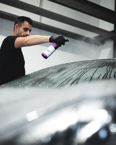 CarPro IronX 500ml bottle beside clean car wheel
