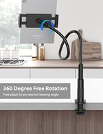 Reinforced base clamp of the tablet holder attached firmly to a wooden bed headboard.