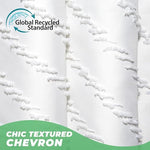 Close up view of textured tufted chevron stripes on white cloth curtain