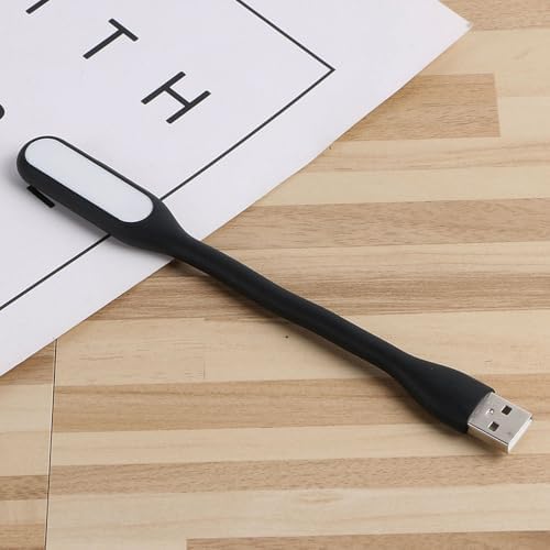Flexible USB LED reading light connected to a laptop keyboard
