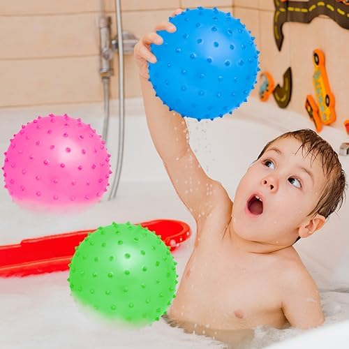 Close up of the toddler soccer ball and rugby ball with the included hand pump.