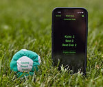 App-enabled electronic footbag displaying the internal battery installation process.