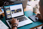 Ultra thin profile view of Jungle Deer webcam cover demonstrating complete flat laptop closure