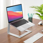 Minimalist silver metallic desk setup featuring the sturdy universal laptop holder.