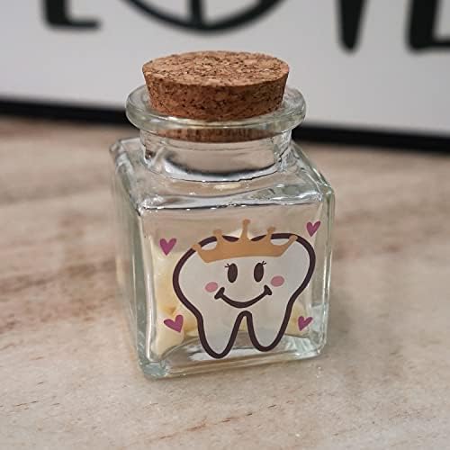 Hamuiers tooth fairy keepsake box next to baby teeth