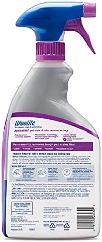 Bissell pet stain remover spray bottles showing the triple action cleaning system label.