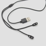 Close up view of the 2 pin magnetic connector pins highlighting the 2.5mm spacing