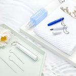 Portable stainless steel dental kit with keychain case.
