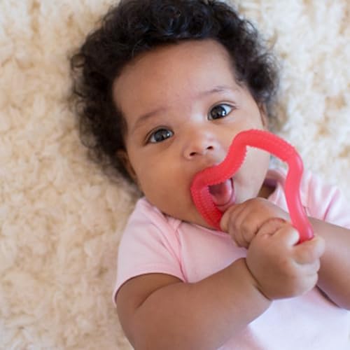 Dr. Brown's baby teether held in infant hands demonstration