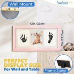 Bubzi Co ballet pink wooden frame displayed on a modern nursery room wall.