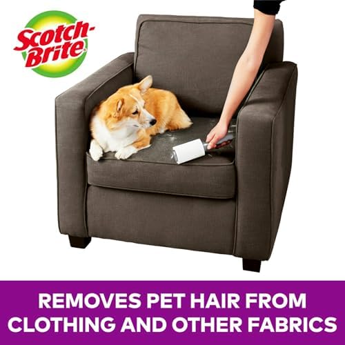 Close up of Scotch-Brite extra sticky adhesive sheets picking up cat fur from a sofa.