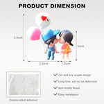 Close up of kissing boy and girl resin car ornament