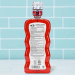 ACT Cinnamon flavored alcohol free mouthwash bottle with precise dosing cup.
