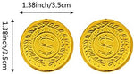A single SNAPPSY plastic gold coin close up showing the detailed embossed monetary symbol on a textured surface.