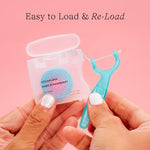 Dentist designed kids dental flosser handle being held by an adult for toddler oral care