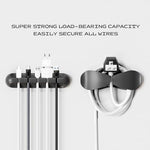 Assorted three five and seven slot desk wire management clips holding multiple charging cables