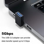 Compact USB 3 point 0 right angle adapter connected to a laptop side port