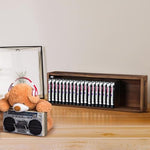 Two piece wooden CD and DVD storage box holder mounted on a living room wall