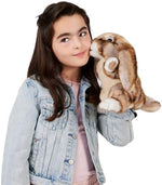 Folkmanis Silky Bunny Rabbit puppet sitting upright on a flat surface