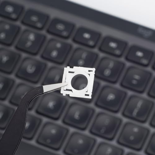 Logitech MX Keys compatible mechanical support brackets displayed alongside repair tweezers on a neutral background