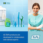 Ergonomic handle of TePe original yellow dental brush for easy grip