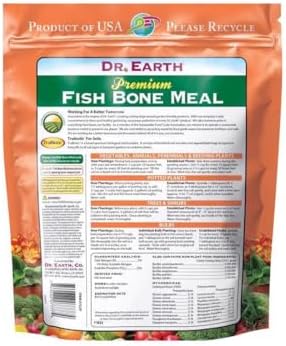 Gardening application of Dr. Earth organic fertilizer for roots and blooms