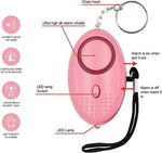 Woman attaching Kosin safety alarm to handbag