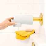 Flexible silicone material of the Munchkin safety cover being adjusted for installation.