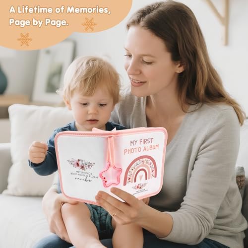 Open fabric photo book displaying protective slots for family pictures and newborn safety mirror.
