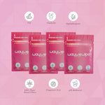 Individually wrapped WayWeWipe XL rosewater wipes spread out showing travel-friendly packaging.