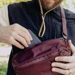 Peak Design Outdoor Sling 7 Litre Eclipse model shot illustrating the crossbody and active stabilizer strap fit