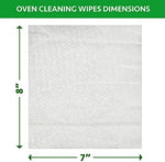 Close up of a person using a Cadie orange oil wipe to clean a microwave interior
