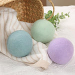 Pastel colored organic laundry balls showcasing the premium handmade texture