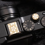 DBZZ copper alloy hot shoe protector cap installed on retro camera
