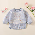 Close up view of the adjustable hook and loop neck closure on the YeeLauf infant feeding smock apron.