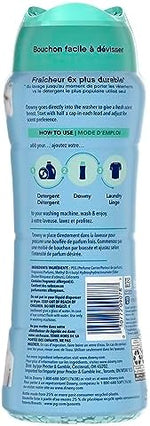 Close up of blue Downy scent booster beads for long lasting laundry fragrance.