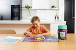 Crocodile Creek Thirty-Six Animals dinosaur puzzle completed on the floor showing detailed prehistoric illustrations.