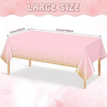 Close up of gold foil dot design on pink plastic tablecloth