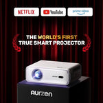 Aurzen portable movie projector displaying automated focus setup on a home theater wall screen.