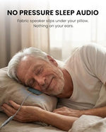 Avantree Slumber Mini speaker being slipped flat inside a beige cotton fabric pillowcase cover.