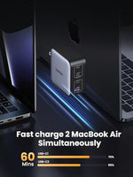 UGREEN high speed desktop charger resting next to a modern smartphone and laptop
