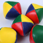 Ten-pack assortment of URATOT durable colorful juggling beanbags arranged neatly next to the included black mesh storage travel bag.