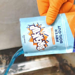 Professional kitchen staff using Diversey fryer cleaner to remove carbonized grease