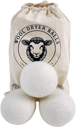 Extra large natural fabric softener balls inside storage bag