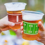Gatherfun imported USA party supplies football cups stacked on a table.