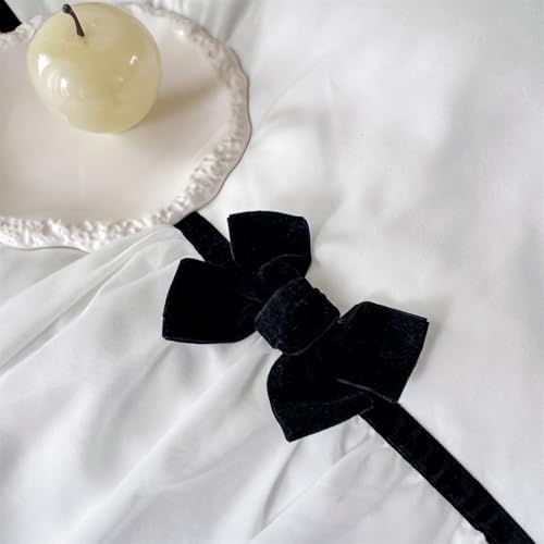 Soukechy white ruffled bedding arranged beautifully under romantic bedroom lighting