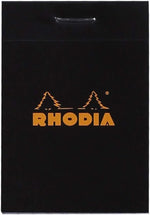 Rhodia small graph notepad next to a pen for size comparison