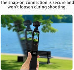 Extended five thousand milliampere hour power grip attached to an action camera setup.
